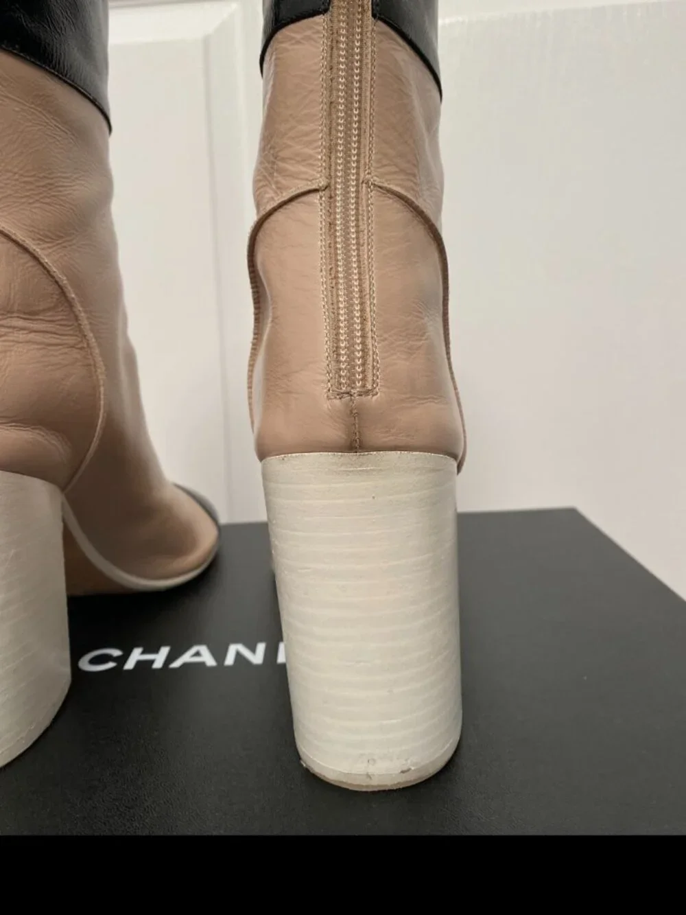 CHANEL Two-Toned Leather Cap-Toe Block Heel Ankle Boots in Beige & Black